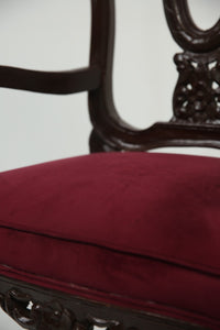 Dark brown carved wooden arm chair with maroon poshish. - GS Productions